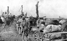 En territoire libere; Un convoi de ravitaillement sur la route de Doincourt a Roye 1917. Creator: Unknown