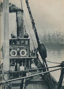 Entering Grimsby Docks at the end of a North Sea voyage is the fishing vessel Saurian 1937