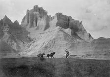 Entering the Bad Lands. Three Sioux Indians on horseback, c1905. Creator: Edward Sheriff Curtis