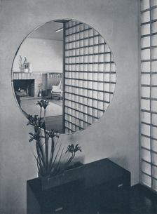 Entrance hall in the house of Dr. and Mrs. James B. Graeser in Oakland, California, showning the gl Artist: Michael Goodman