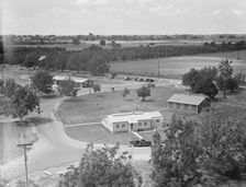 Entrance to camp showing clinic, Farmersville, California, 1939. Creator: Dorothea Lange