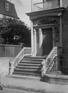 Entrance to a multi-story house, New Orleans or Charleston, South Carolina, between 1920 and 1926. Creator: Arnold Genthe