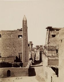 Entrance to Temple of Luxor with Modern Mud-Brick Houses. Luxor, East Bank, between 1860 and 1903. Creator: Antonio Beato