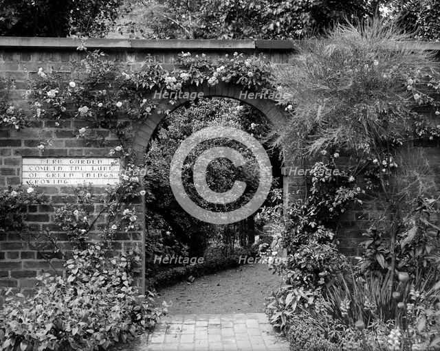  Entrance to the herb garden in Wardrobe Court, Hampton Court Palace, Richmond, London. Artist: Alfred Newton & Sons