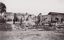 [Encampment with shacks and laundry]. Brady album, p. 129, 1861-65. Creator: Unknown