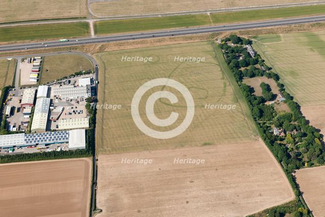 Enclosure and ring ditch crop marks near Minster, Kent, 2015. Creator: Historic England.