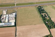 Enclosure and ring ditch crop marks near Minster, Kent, 2015. Creator: Historic England