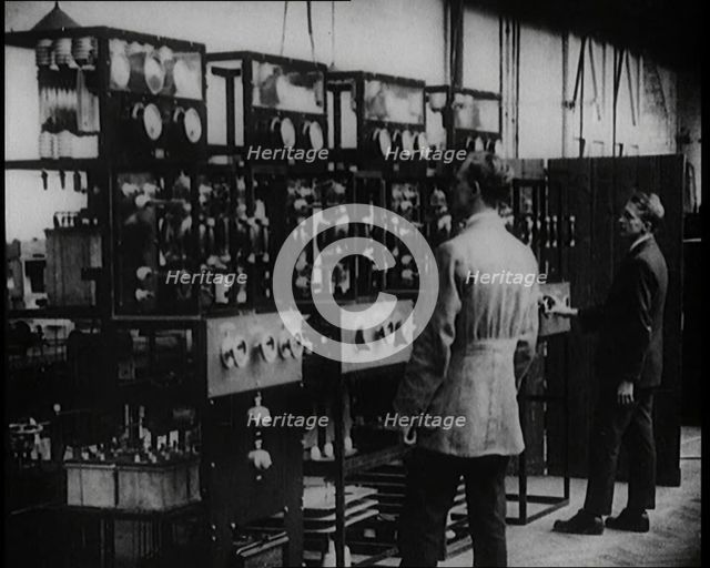 Engineers Observing Valves and Turning Pressure Dials, 1922. Creator: British Pathe Ltd.