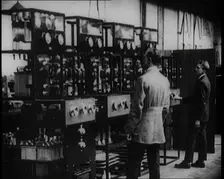 Engineers Observing Valves and Turning Pressure Dials, 1922. Creator: British Pathe Ltd