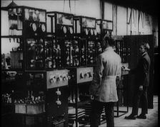 Engineers Observing Valves and Turning Pressure Dials, 1922. Creator: British Pathe Ltd