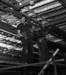 Engineers lifting steelwork into position, South Yorkshire, 1954. Creator: Michael Walters