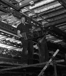Engineers lifting steelwork into position, South Yorkshire, 1954. Creator: Michael Walters