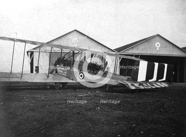 England. Caproni 600 biplane H 1918 next to the hangars.