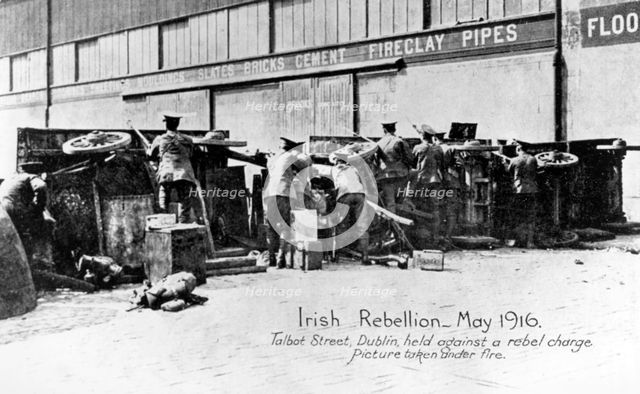 English troops under fire in Talbot Street, Anti-English Irish uprising, Dublin, May 1916. Artist: Unknown