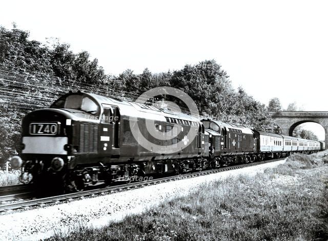 English Express train pulled by two diesel locomotives, travelling at 160 kilometers per hour bet…