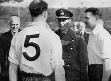 English footballer Eddie Hapgood meeting King George VI, c1937-c1944