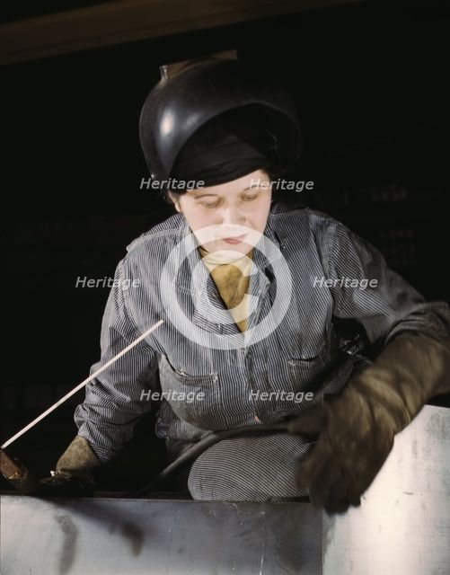 Enola O'Connell, age 32, widow and mother of one child...Heil and Co., Milwaukee, Wisc., 1943. Creator: Howard Hollem.