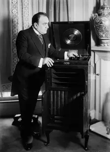 Enrico Caruso with phonograph, 1918 and c1920. Creator: Bain News Service