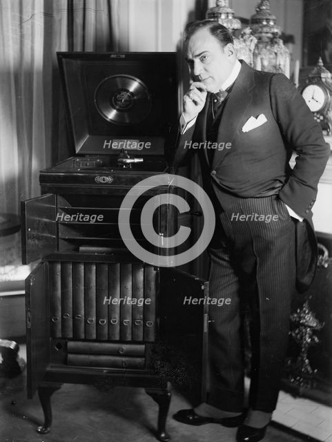 Enrico Caruso with phonograph, between 1918 and c1920. Creator: Bain News Service.