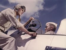Ensign Noressey and Cadet Thenics at the Naval Air base, Corpus Christi, Texas, 1942. Creator: Howard Hollem