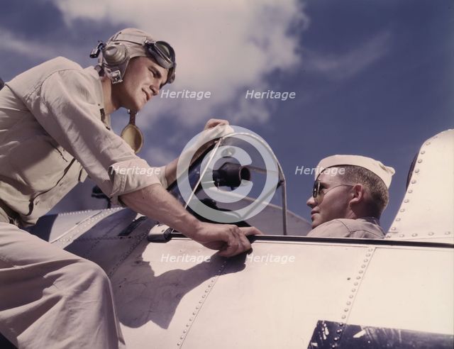 Ensign Noressey and Cadet Thenics at the Naval Air base, Corpus Christi, Texas, 1942. Creator: Howard Hollem.