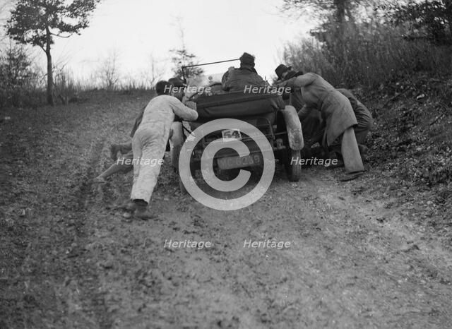 EA Beale's Vauxhall 30-98 Velox 4 seater receiving a push during the Inter-Varsity Trial, 1930. Artist: Bill Brunell.