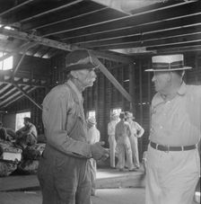 Each farmer follows his tobacco in the warehouse to learn what price..., Douglas, Georgia, 1938. Creator: Dorothea Lange