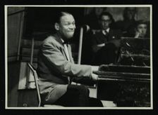 Earl Fatha Hines at the piano, 1950s. Creator: Denis Williams