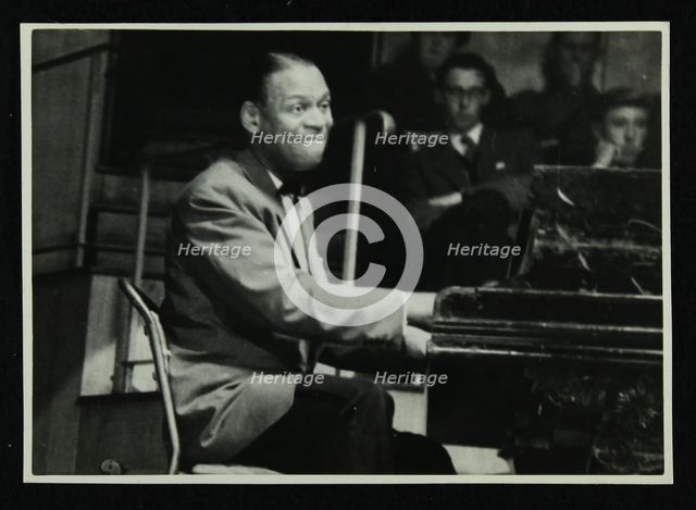 Earl 'Fatha' Hines at the piano, 1950s. Creator: Denis Williams.