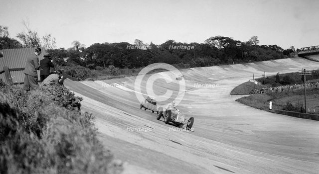 Earl Howe's Delage GP leading ER Hall's Bentley at the BARC Meeting, Brooklands, 25 May 1931. Artist: Bill Brunell.