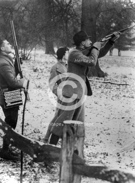 Earl of Shrewsbury, Miss Lane and their chauffeur on a shoot, c1946. Artist: Unknown