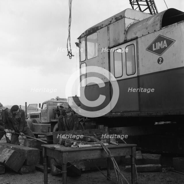 Early 1940s Diamond T truck pulling a large load, South Yorkshire, 1962. Artist: Michael Walters