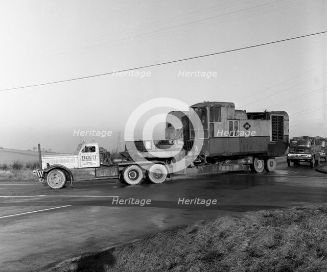 Early 1940s Diamond T truck pulling a large load, South Yorkshire, 1962. Artist: Michael Walters