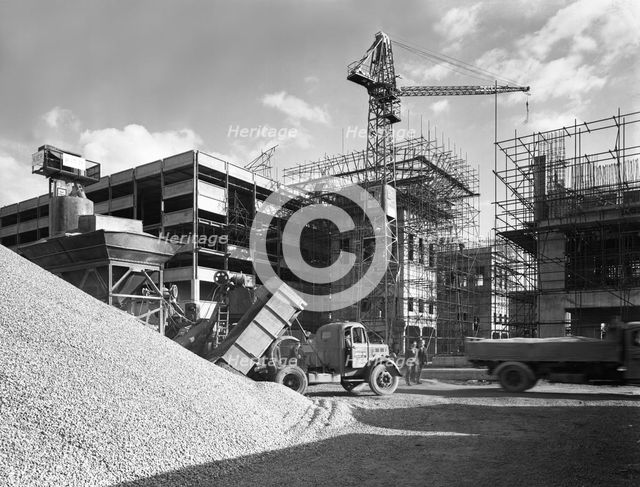 Early 1950s Bedford M Tipper delivering aggregates to a building site, South Yorkshire, July 1954. Creator: Michael Walters.