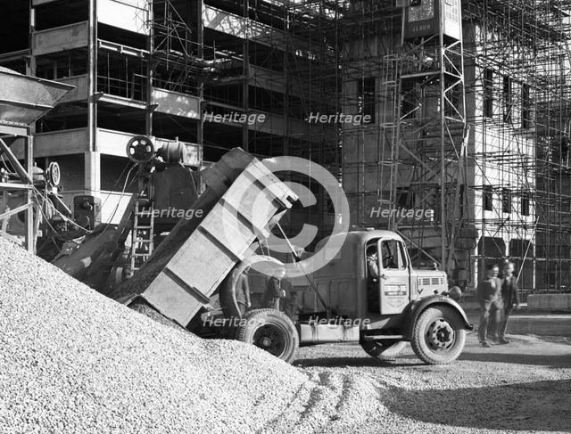 Early 1950s Bedford M Tipper delivering aggregates to a building site, South Yorkshire, July 1954. Creator: Michael Walters.