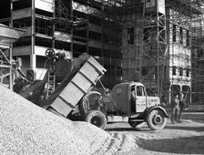 Early 1950s Bedford M Tipper delivering aggregates to a building site, South Yorkshire, July 1954. Artist: Michael Walters