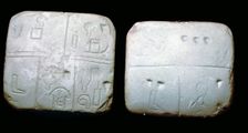 Early Sumerian stone tables, inscribed with very early archaic pictographic symbols
