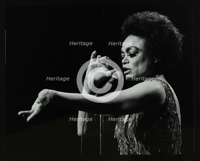 Eartha Kitt performing at the Forum Theatre, Hatfield, Hertfordshire, 20 March 1983. Her concert end Artist: Denis Williams
