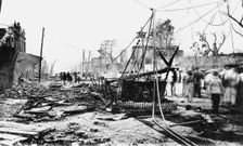 Earthquake damage and a burnt car, King Street, Kingston, Jamaica, 1907