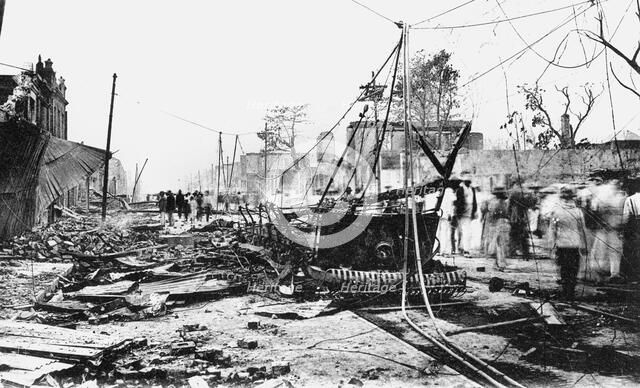 Earthquake damage and a burnt car, King Street, Kingston, Jamaica, 1907. Artist: Unknown
