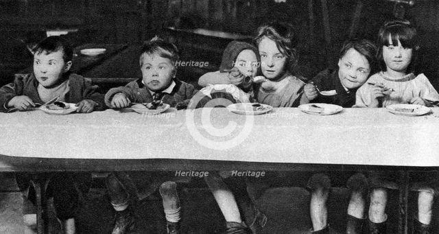 East End children being fed by a charitable organisation, London, 1926-1927. Artist: Unknown