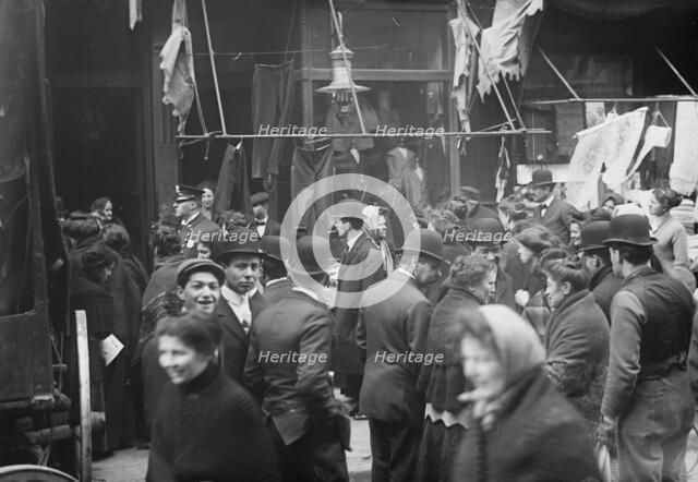 East side crowd discussing price of meat in front of shops, New York, 1910. Creator: Bain News Service.