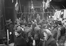 East side crowd discussing price of meat in front of shops, New York, 1910. Creator: Bain News Service