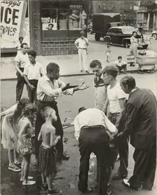 Eastside - Group of men and youths gathered around an accident victim; one young..., 1947 - 1951. Creator: Romulo Lachatanere