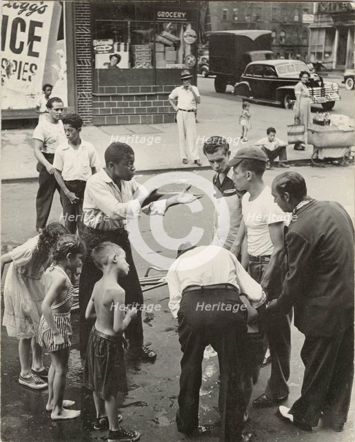 Eastside - Group of men and youths gathered around an accident victim; one young..., 1947 - 1951. Creator: Romulo Lachatanere.