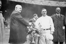 Edward McCall presents a silver basket of flowers to New York Giants manager John McGraw..., 1913. Creator: Bain News Service