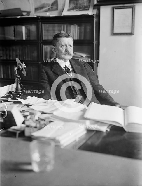 Edward B. Moore, Commissioner of Patents - At Desk, 1912. Creator: Harris & Ewing.
