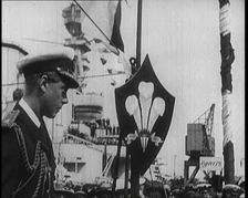 Edward, Prince of Wales, Stood on a Dock, With a Large Ship Behind Him, 1922. Creator: British Pathe Ltd