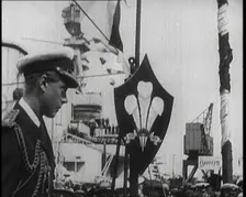 Edward, Prince of Wales, Stood on a Dock, With a Large Ship Behind Him, 1922. Creator: British Pathe Ltd