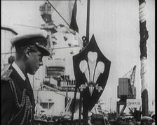 Edward, Prince of Wales, Stood on a Dock, With a Large Ship Behind Him, 1922. Creator: British Pathe Ltd